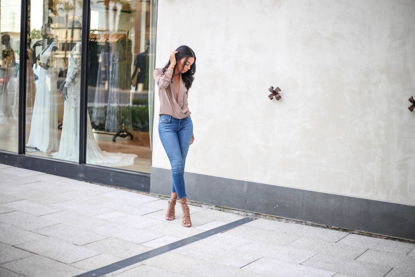 Mother crop denim with a twist front blouse and lace up nude heels
