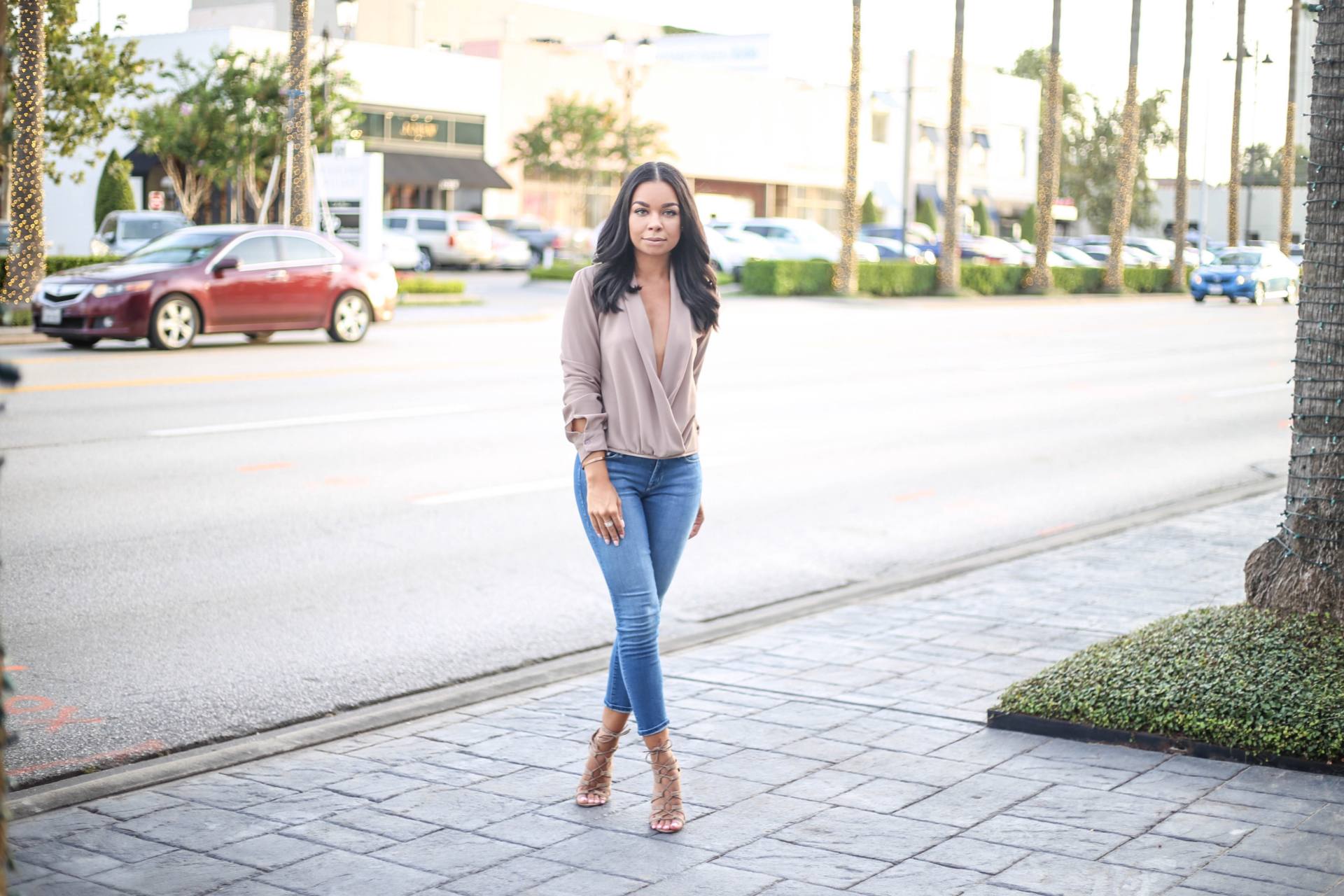 Mother crop denim with a twist front blouse and lace up nude heels